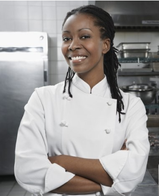 A cheerful chef in a white uniform.